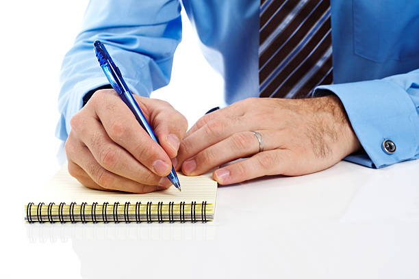 Business man making notes stock photo