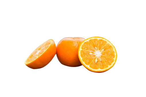Fresh cut oranges and oranges isolated on white background