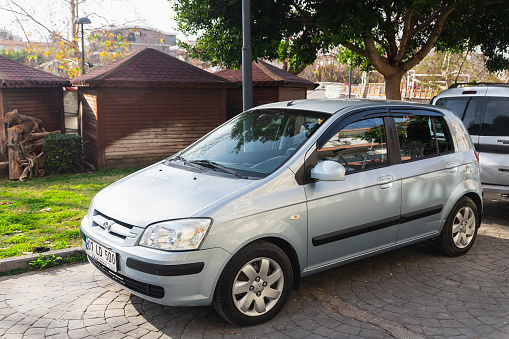 Side, Turkey -January 23, 2023:    silver  Hyundai Getz  is parking  on the street on a  summer day