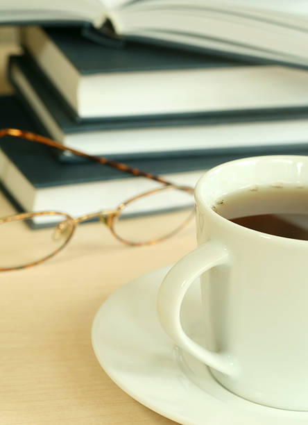 istock Cup of tea, books and eyeglasses 147289825