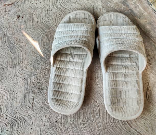 istock a pair of bone-white rubber sandals 1472899354