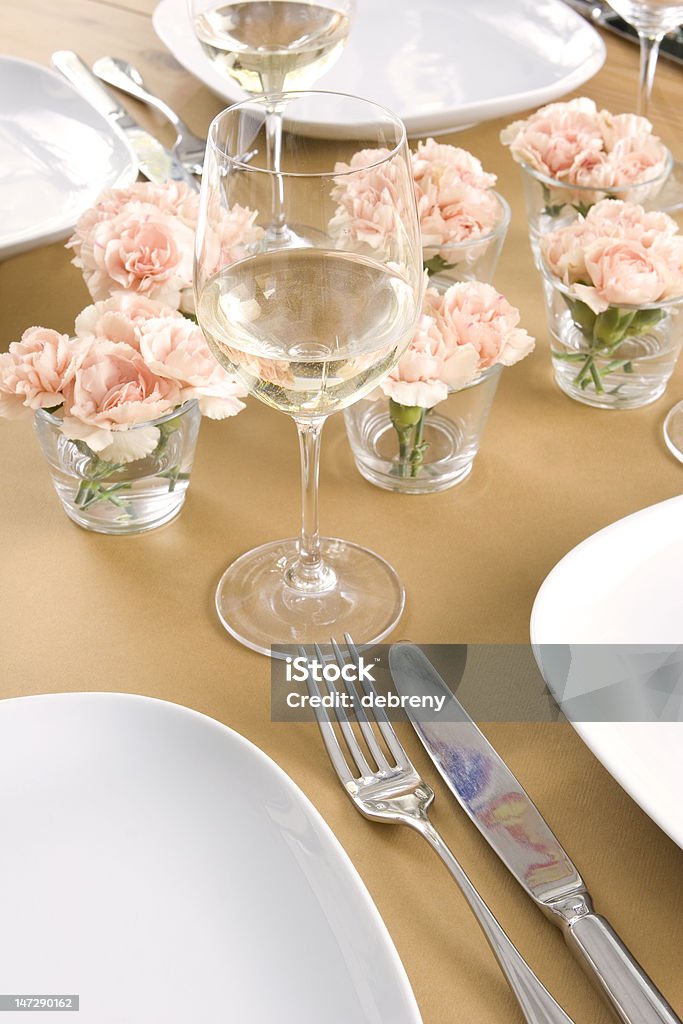 table setting with flowers table setting - knife, fork, plates & wine - with flowers Bright Stock Photo
