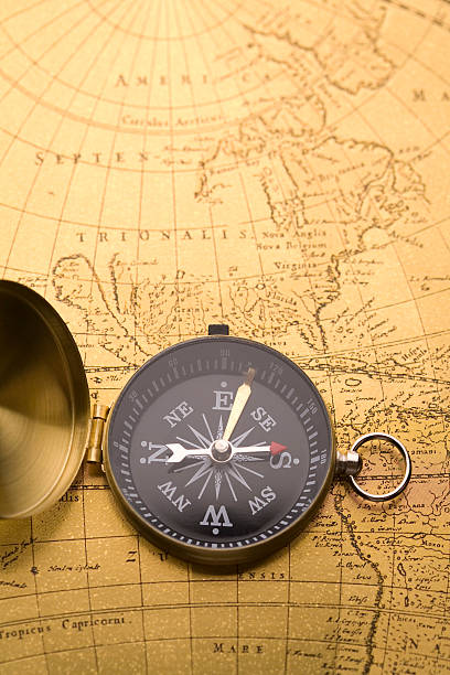 istock Beautiful golden compass on an old map 147290648