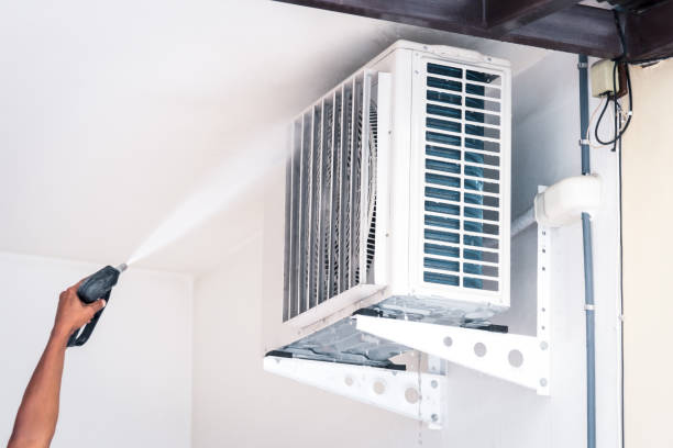 istock Cleaning air conditioner by water for clean a dust 1472906701