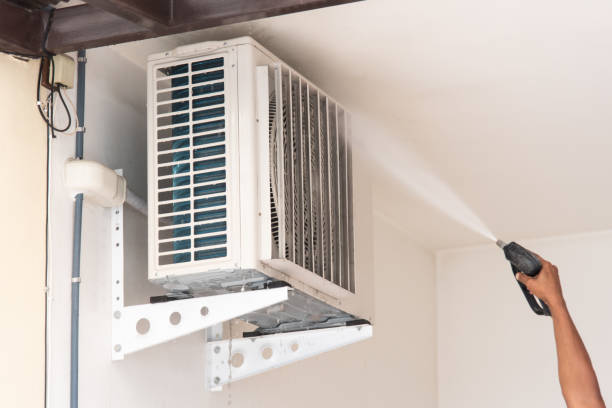 istock Cleaning air conditioner by water for clean a dust 1472906702