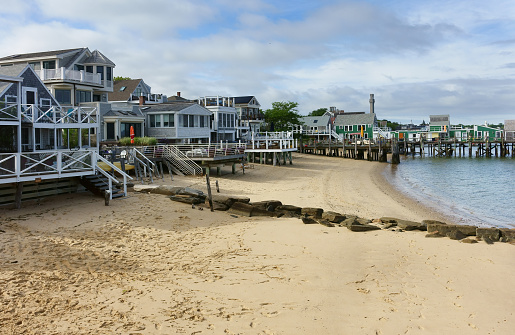 Beach cottages with terrace and pier on a summer day, Provincetown, massachusettsgay village, USA