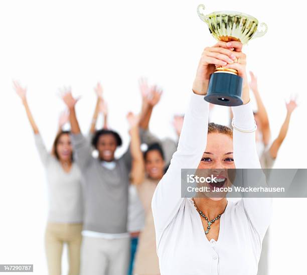 Excited Young Woman Holding Cup Stock Photo - Download Image Now - Trophy - Award, Women, Holding