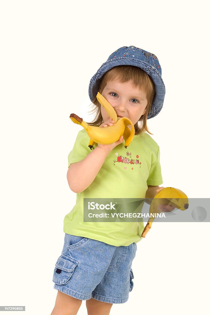 Little girl eats бананом - Стоковые фото 2-3 года роялти-фри