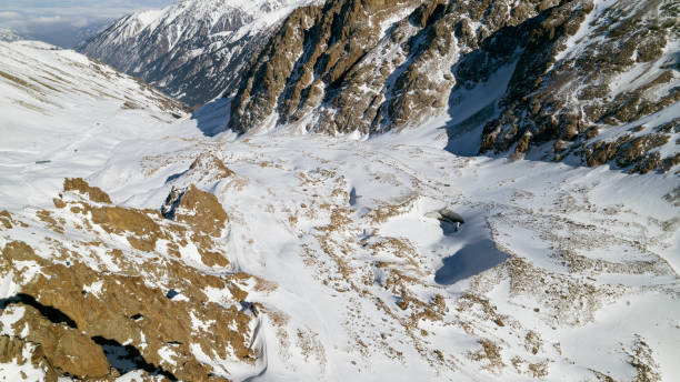 istock A huge glacier in the mountains and tourists 1472910640