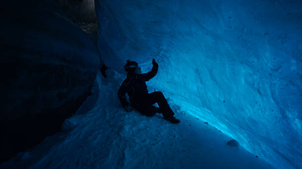 istock The climber made a halt inside an ice cave. 1472910642