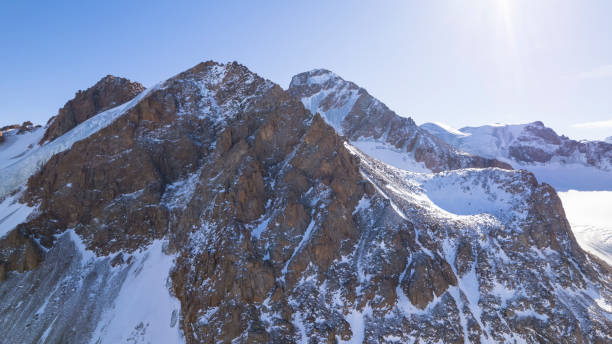 istock High snow capped mountains among large glaciers. 1472910673
