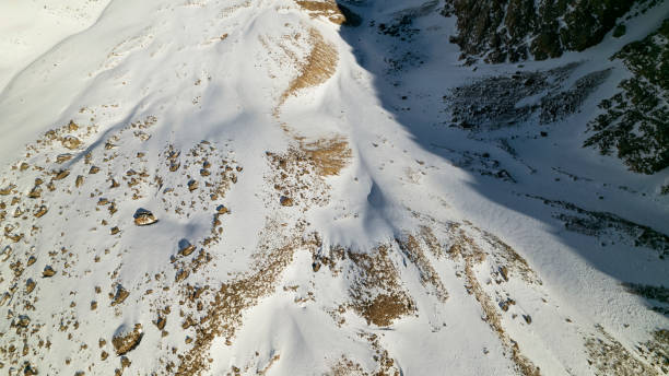 istock A huge glacier in the mountains and tourists 1472910680