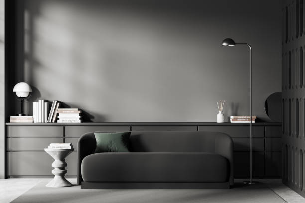 istock Grey chill room interior with couch and drawer with decor. Mockup empty wall 1472912310