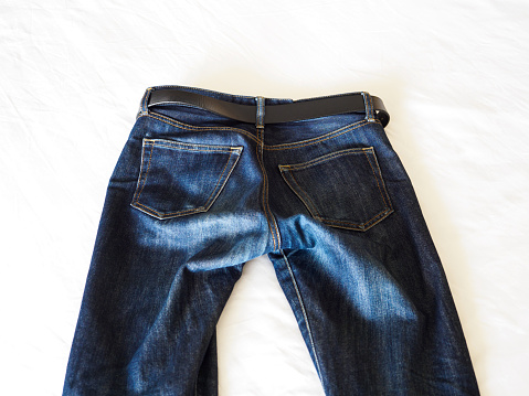 Close-up of jeans on white background