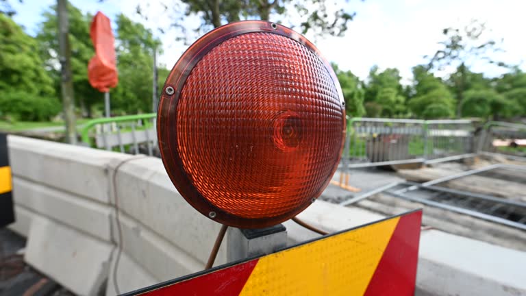 Roadworks warning light blinking to warn cars and pedestrians