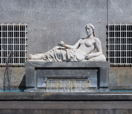 Turin, Italy - Circa September 2022: Statue symbolising river Dora by sculptor Umberto Baglioni circa 1936