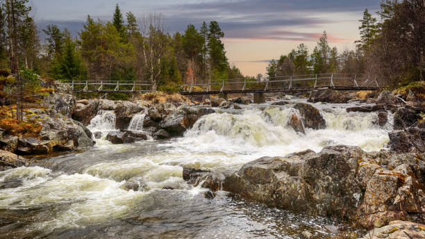 istock Spring flood at the river Inna, Norway 1472917425