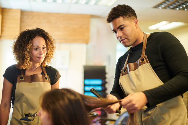 istock trainee hairdresser 1472921105