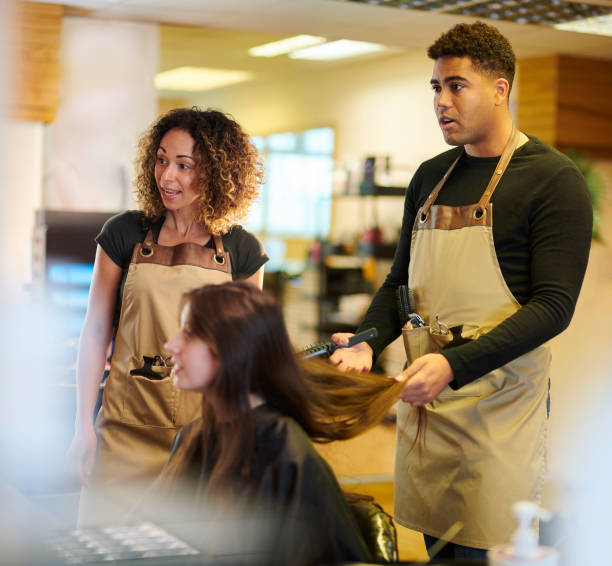 istock trainee hairdresser 1472921151