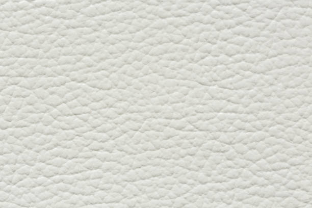 istock The texture of genuine leather is a light white tone. Background backdrop textured effect for design. Faux eco leather piece of faux leather. Matt, extra soft beige material. 1472921157