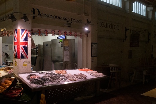 photograph of the butchers shop in Oxford's Covered Market. \nThe Covered Market is a historic market with permanent stalls and shops in a large covered structure in central Oxford, England