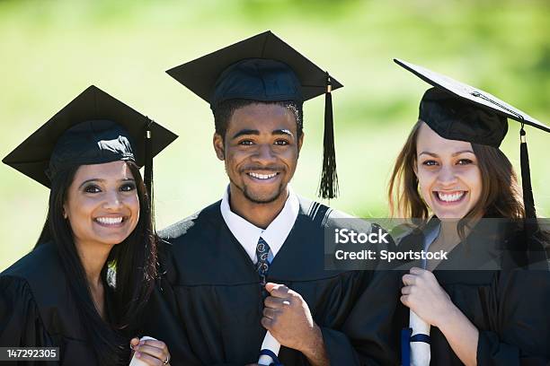 Multiracial Classmates Smiling On Graduation Day Stock Photo - Download Image Now - Graduation, Happiness, Tassel