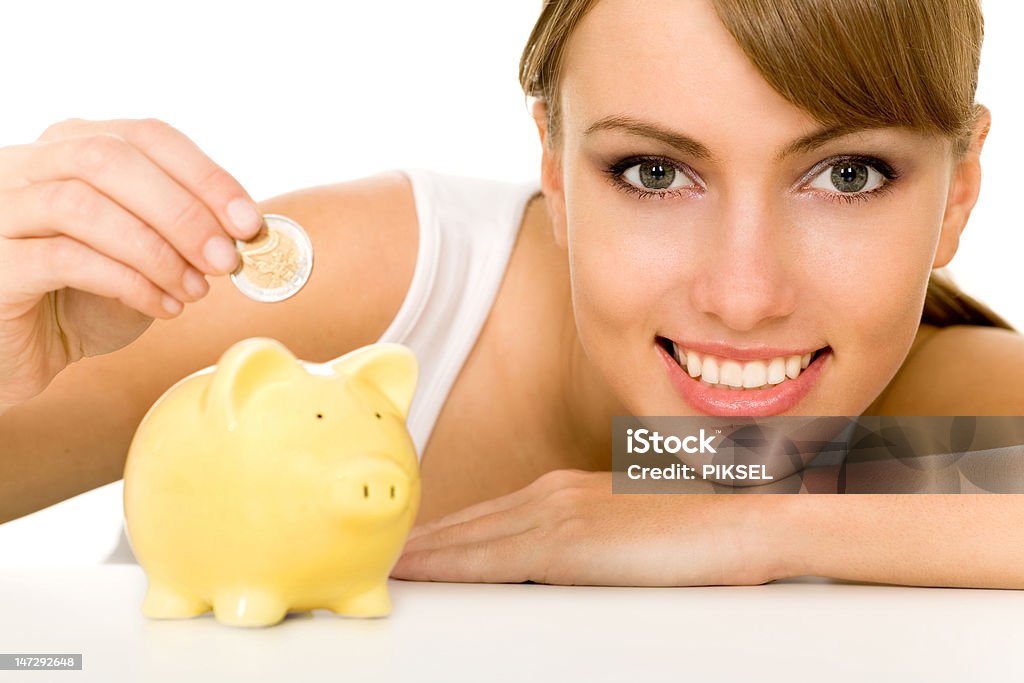 Woman putting coin in piggy bank http://www.edkafelek.com/people.jpghttp://www.edkafelek.com/money.jpg Adult Stock Photo