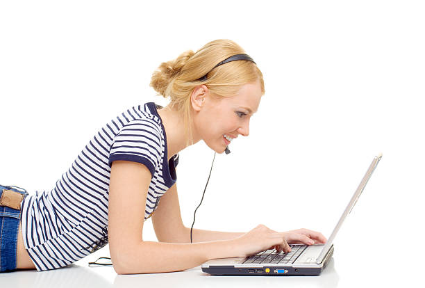 Beautiful young woman using laptop stock photo