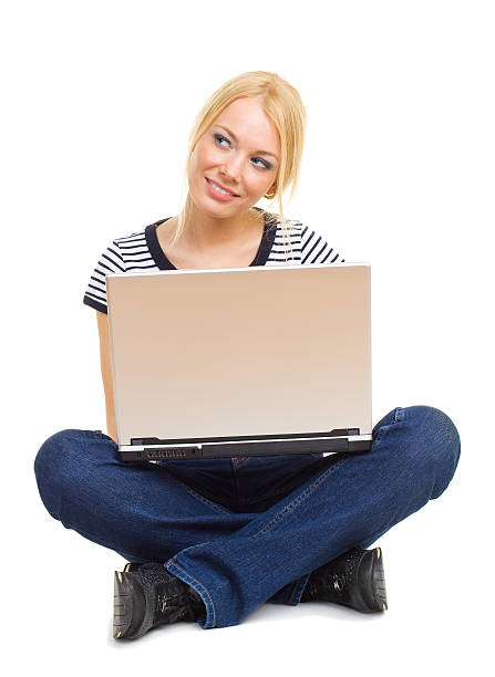 istock Beautiful young woman using laptop 147293041