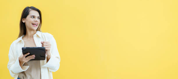istock Woman holding a digital tablet. 1472932559
