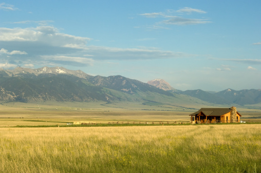 Ranch house with mountains on background in Montana, USA