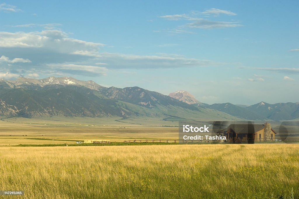 Montana ranch Ranch house with mountains on background in Montana, USA Rural Scene Stock Photo