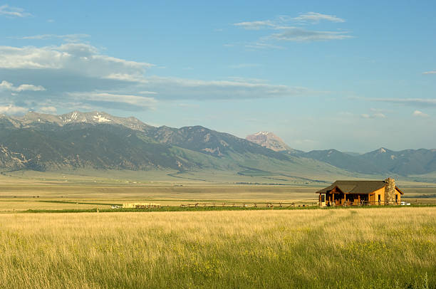 Montana ranch Ranch house with mountains on background in Montana, USA west direction photos stock pictures, royalty-free photos & images