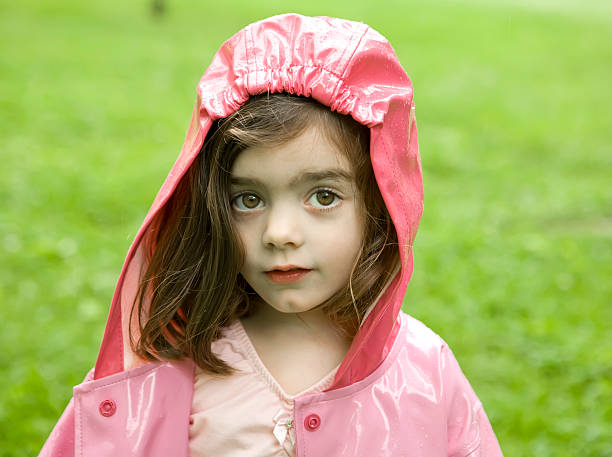 Little Girl in Raincoat stock photo
