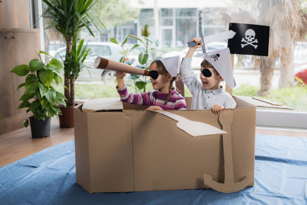 Children playing pirates roleplay game at home
