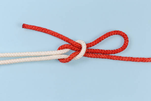 istock Rope Singly slipped reef knot on a blue background 1472939423