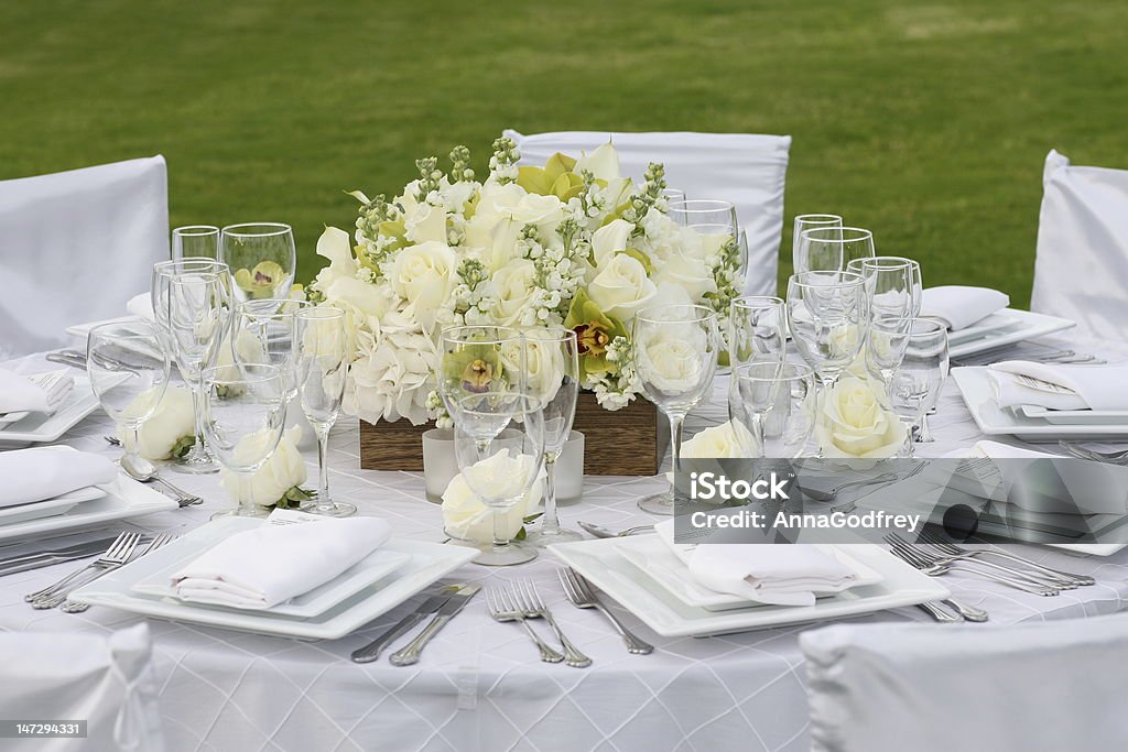 White Rose Dining Elegant dining table with white roses. Arrangement Stock Photo