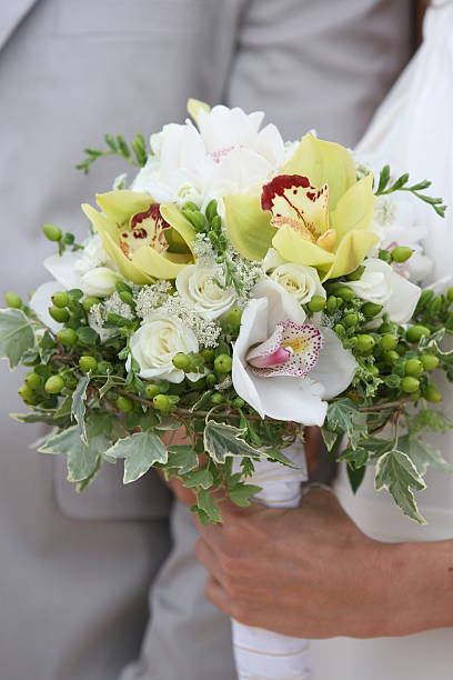 istock Green Orchid, White Rose, and Ivy  Bouquet 147294344