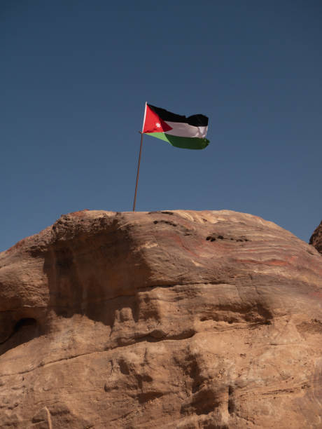 istock Flag of Jordan waving in the wind. 1472944642