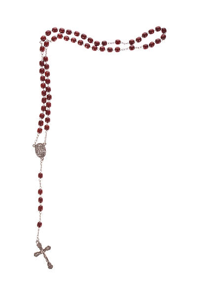 Red rosary beads with a cross on a white background Rosary beads isolated over a white background rosary beads stock pictures, royalty-free photos & images