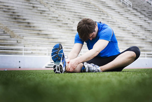 Stretching athlete stock photo