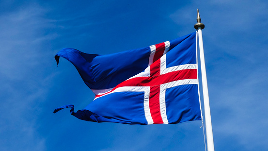 The Saint George's Cross flag in the wind, with the word 'England' superimposed.