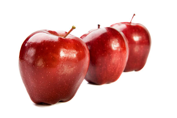 Three red apples on white background stock photo