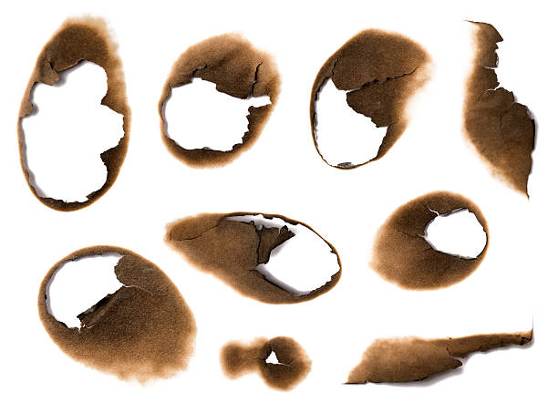 istock Holes burned in paper 147294956