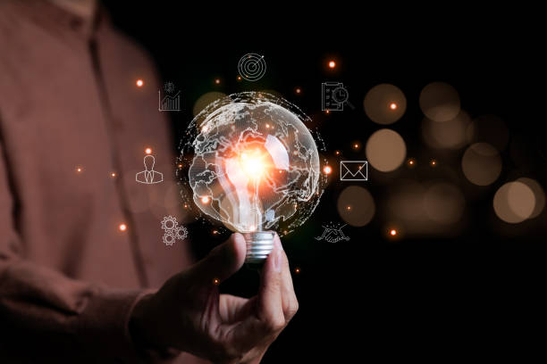 istock Businessman hand holding creative light bulb with icons global Internet connection on plan strategy, Business connection application technology and digital marketing, big data, Financial and banking, 1472950280