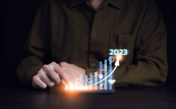 istock Businessman analyzes profitability of working company with digital virtual screen graphics. 2023 Planning invest indicators long-term. positive, businessman calculates financial data investments. 1472950352