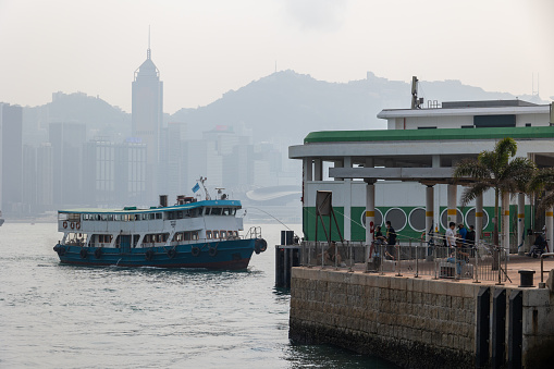 Hong Kong victoria harbor skyline and ferry pier,china.