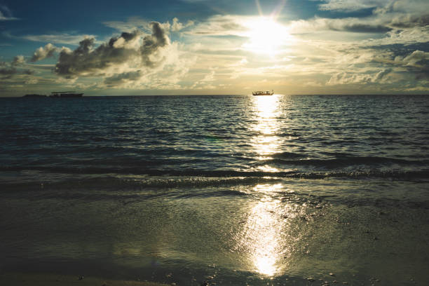 At the ocean in sunset on sunny Maldive island.