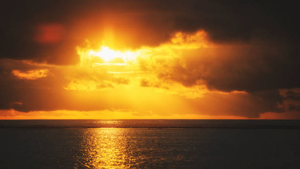 At the ocean in sunset on sunny Maldive island. stock photo