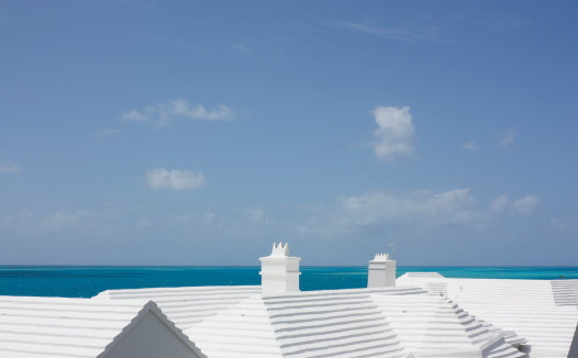 White roofs - it is the law in Bermuda for the owner to supply a proportion of water for their house. All residential and some commercial buildings have whitewashed roofs which collect rain water.